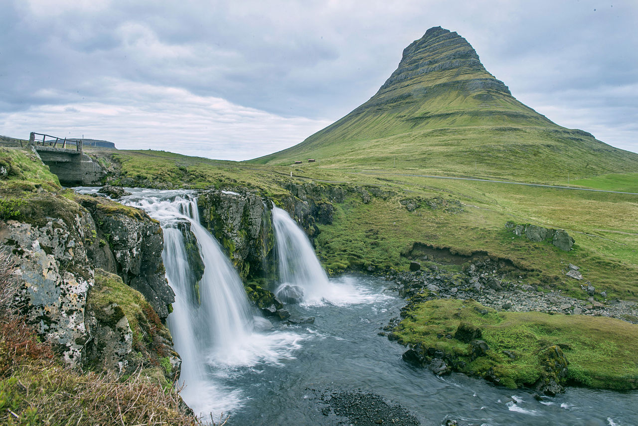 The Kirkjufell mountain in Iceland on a cloudy day. || Kiggal, Anjali. (2015, June 23). Kirkjufell in Iceland [Photograph]. Retrieved October 5, 2015, from Wikipedia: https://en.wikipedia.org/wiki/File:Kirkjufell_in_Iceland.jpg || https://creativecommons.org/licenses/by-sa/4.0/